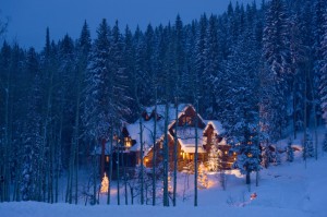 Glowing Luxury Log Cabin Home in Winter with Fresh Snow